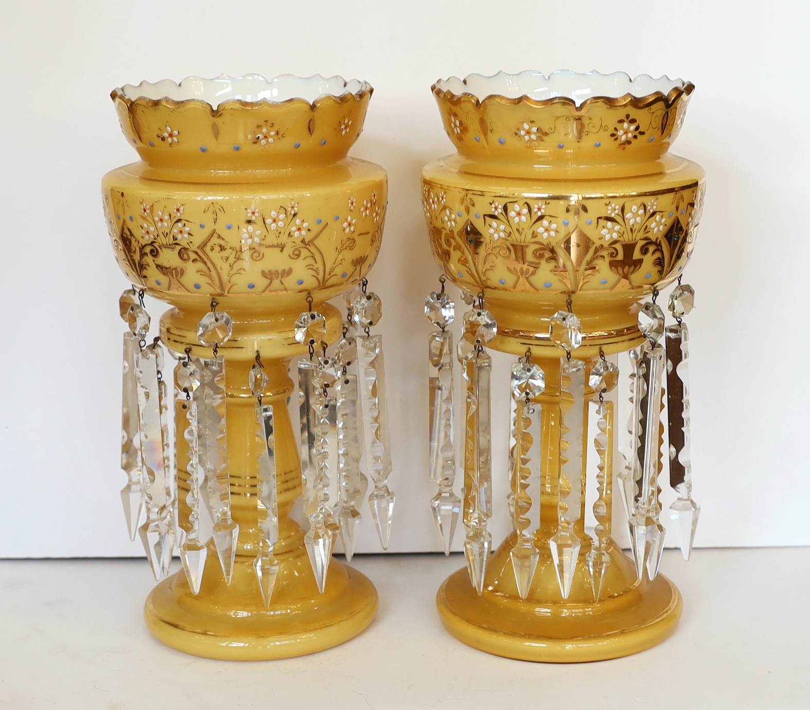 A pair of late 19th century Bohemian opaque glass lustres with enamelled and gilt floral decoration, height 37cm